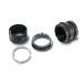 Four black metal rings of varying sizes, some with a ridged surface, placed on a white background.