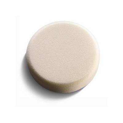 Round, beige foam sponge on a white background.