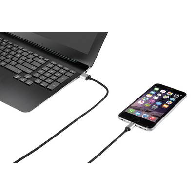 A smartphone is connected to a laptop via a cable, indicating that the device is being charged or synchronised.