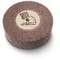 A round grinding stone with a coarse-grained surface and a label in the centre.