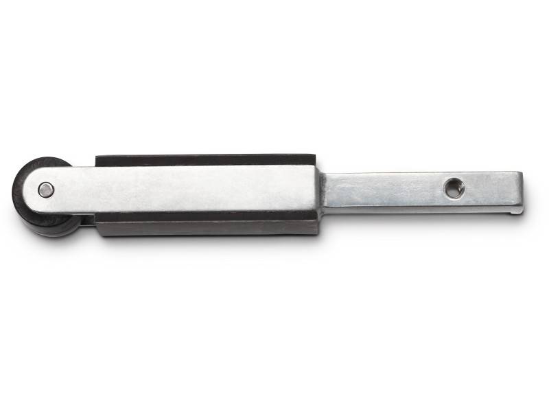 A metallic sliding bracket with a black plastic wheel, likely part of a piece of furniture or sliding mechanism.