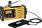A yellow, portable radio with solar cells and a hand crank, charges a smartphone via USB cable. Digital display shows '108.07'.