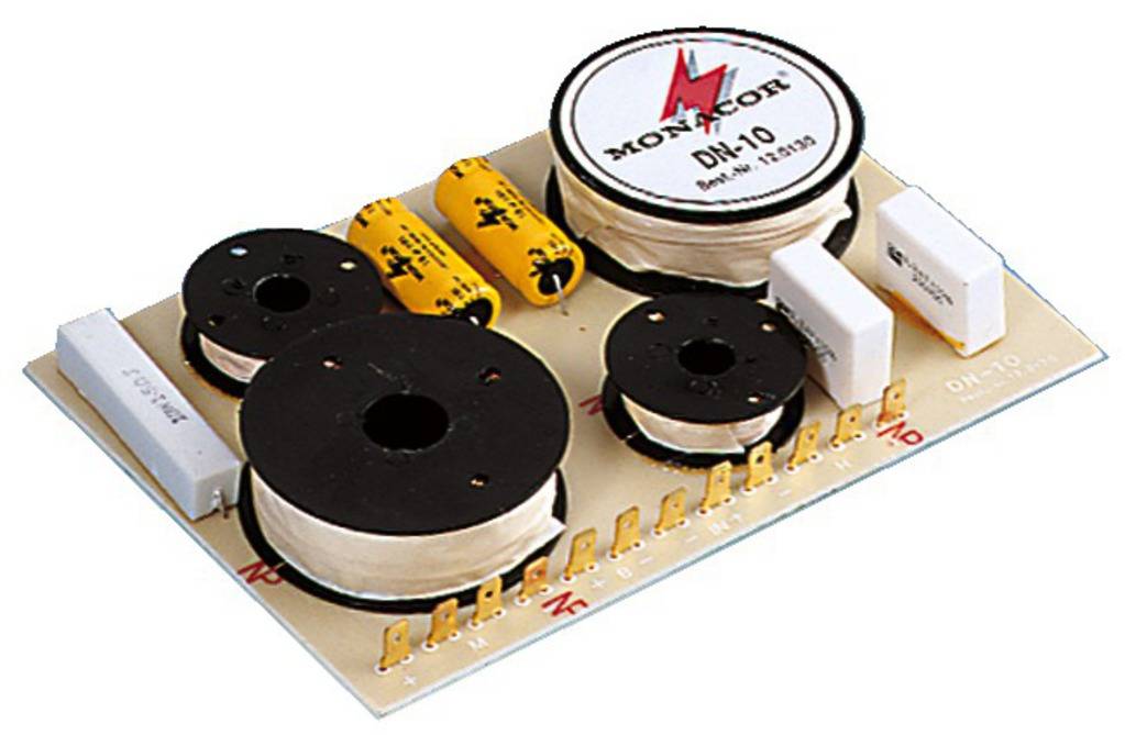 Electronic crossover board with multiple inductors, capacitors, and connectors. Primarily used for audio distribution.