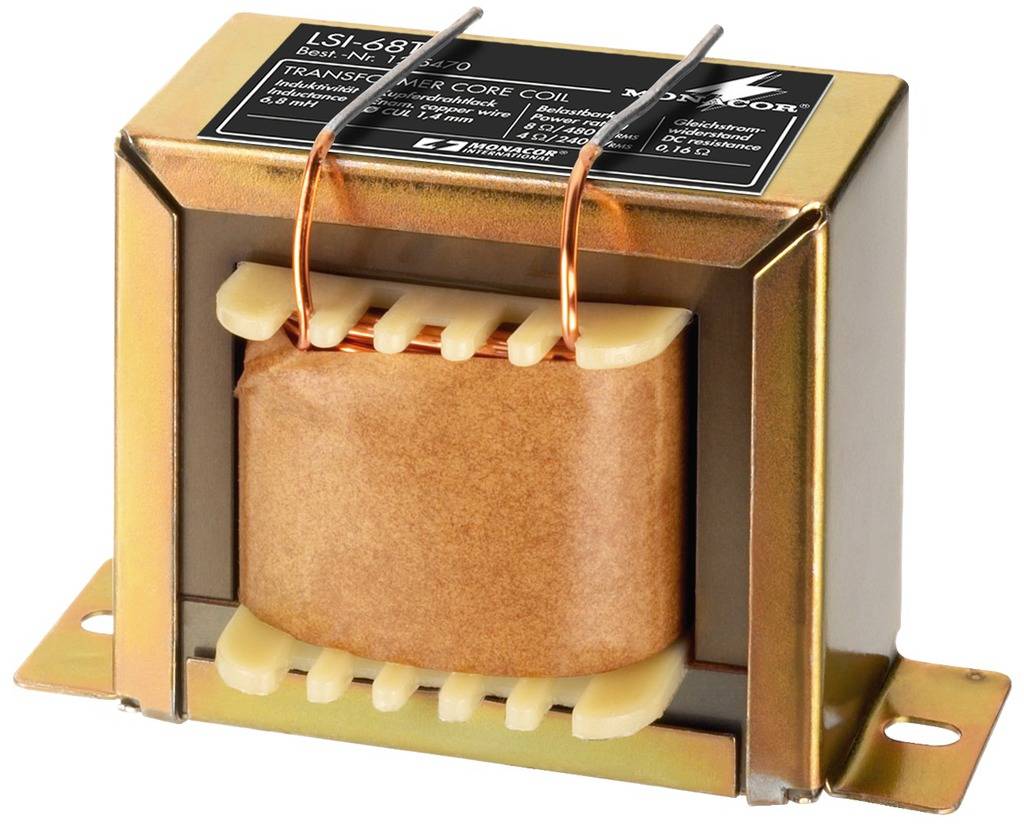 A rectangular transformer with the inscription 'LSI-687' and technical details on the metal casing, mounted on a base plate.