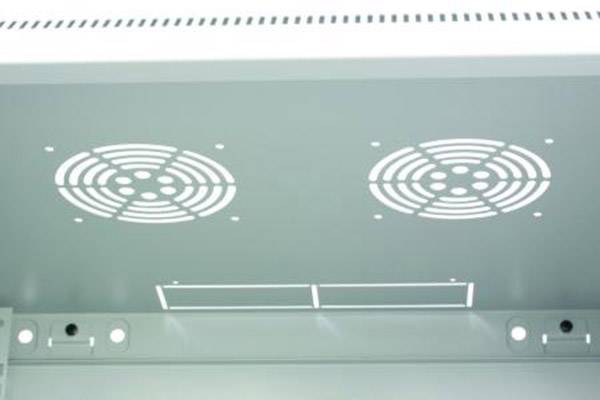Two round air vents on a grey ceiling, likely part of a ventilation system.