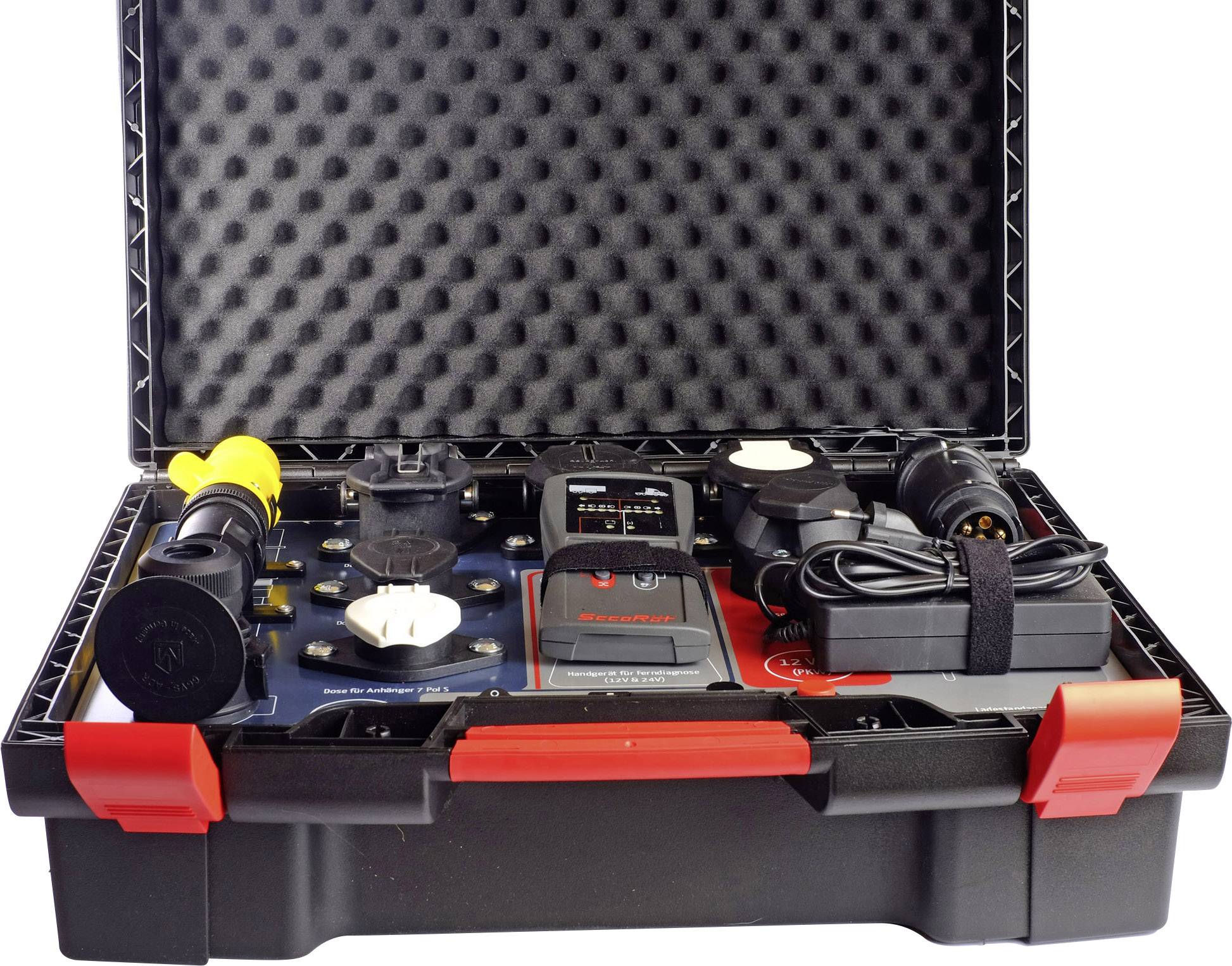 An open black suitcase with red handles contains various chargers and adapters for electric vehicles.