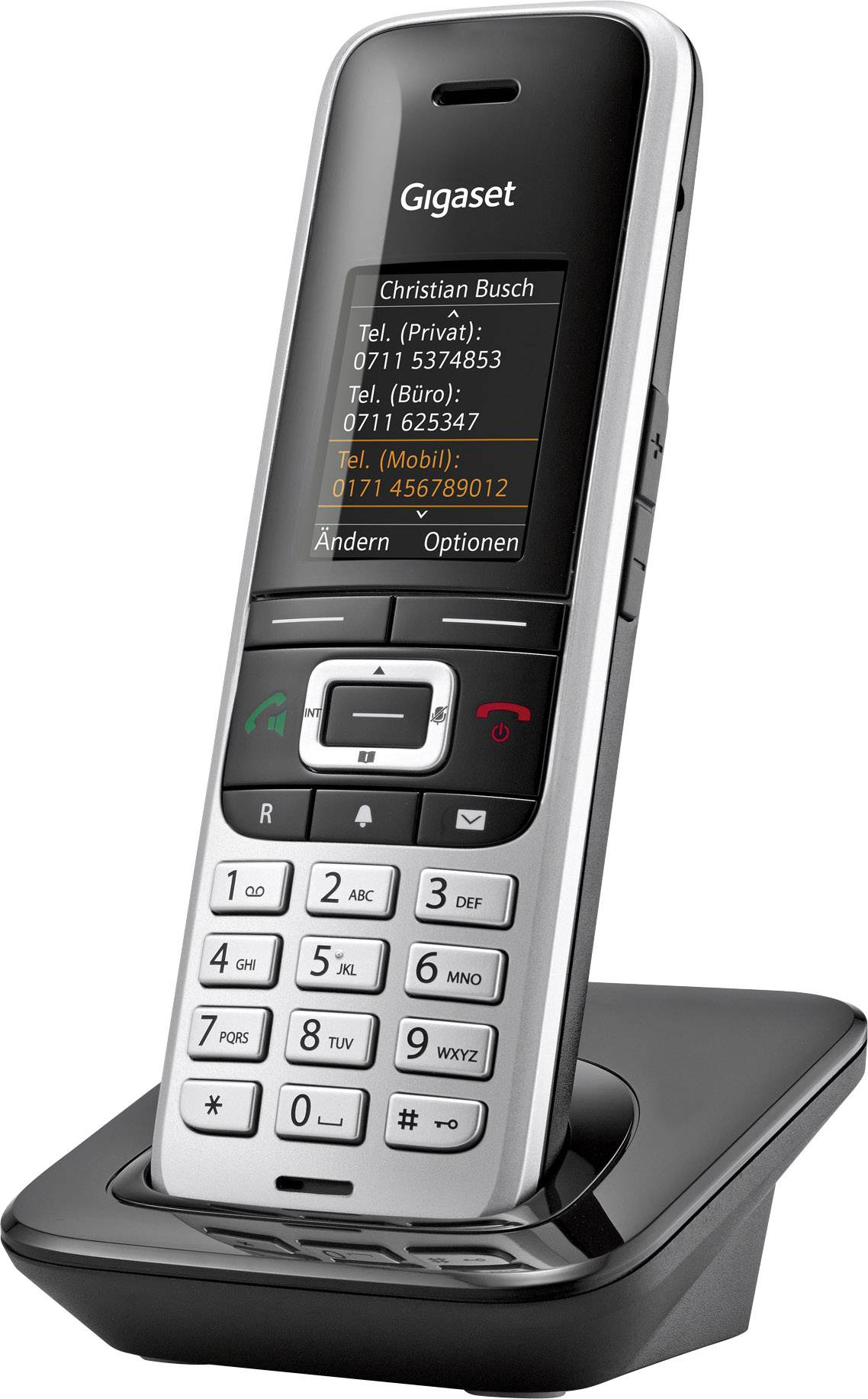 Cordless telephone on charging station. Display shows contact information and various call options.