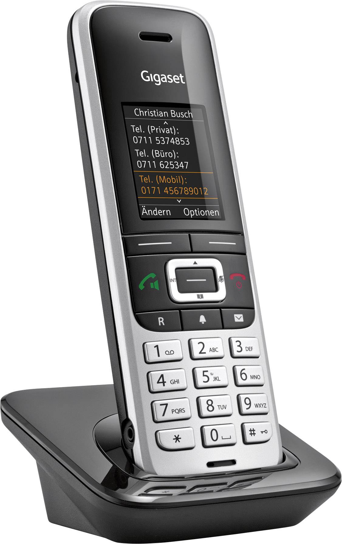 'Cordless Gigaset telephone on charging station, display showing call settings and contact information.'