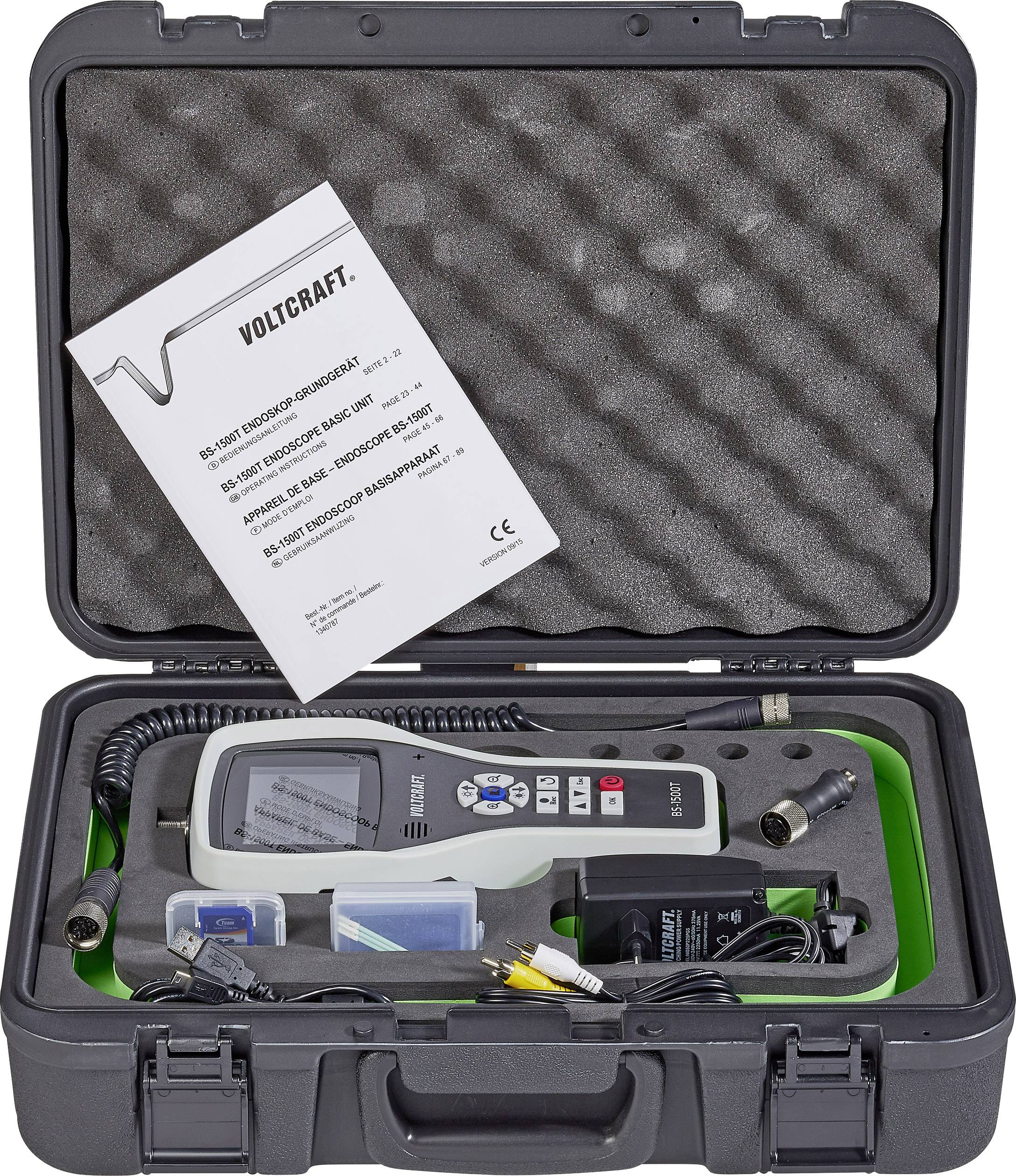 Portable voltage tester by VOLTCRAFT in a hard-shell case with accessories and user manual. Device displays measurement data on screen.