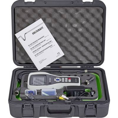 Portable voltage tester by VOLTCRAFT in a hard-shell case with accessories and user manual. Device displays measurement data on screen.