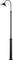 A tall, black street lamp with a curved arm and a round shade shines downwards.