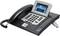 A modern office telephone with a large display and numerous function buttons. Shows the time as 08:01 on the screen.