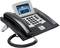 Black desk telephone with keypad, display, and receiver. The display shows '08:01' and 'No missed calls'.