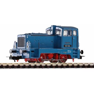 A blue model locomotive on a railway track, with the designation 'V23 024', symbolises a German industrial locomotive.