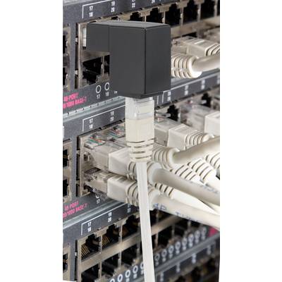 A network switch with numerous plugged-in Ethernet cables, enabling connectivity and data transmission between devices.