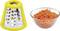 'Grater with yellow handle next to a glass bowl with grated carrots.'