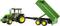 A green tractor with yellow wheels is pulling a trailer with its loading area raised.