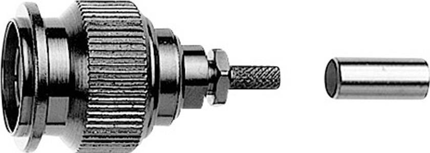 Close-up of a metal adapter with a ridged surface and a cylindrical plug, separated on the right.