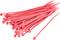 Red plastic cable ties of various lengths are lying in a pile.