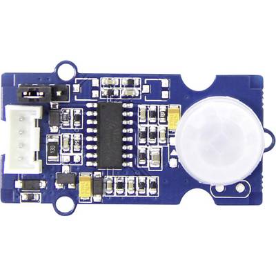 'Blue and white motion sensor with circuit components, including a large black chip and a white circular element on the right.'