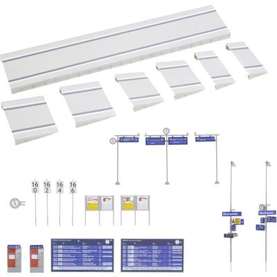 Set of model railway terrain elements: Platforms in various sizes, signs with numbers, timetables, clocks and lamp posts.