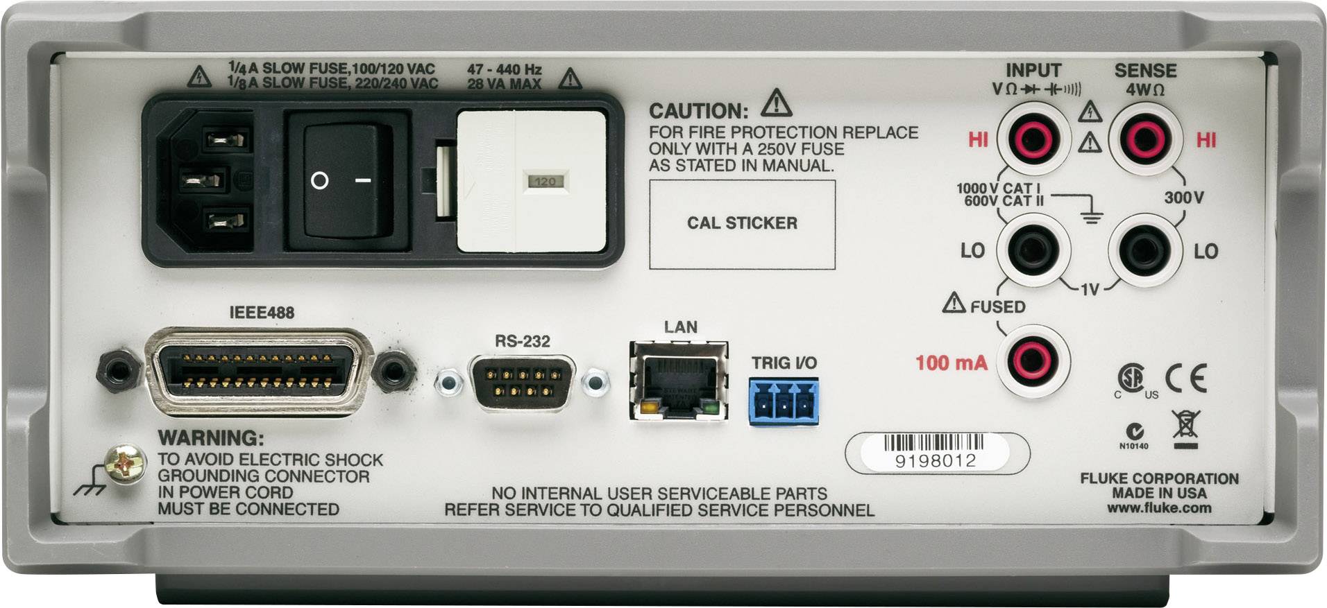 Back of an electronic device with multiple ports and warning labels. Includes power sockets, fuse, RS-232 port, and earthing instruction.