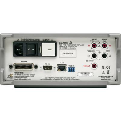 Back of an electronic device with multiple ports and warning labels. Includes power sockets, fuse, RS-232 port, and earthing instruction.