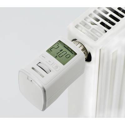 A digital thermostat on a white radiator shows 24.0 degrees Celsius.