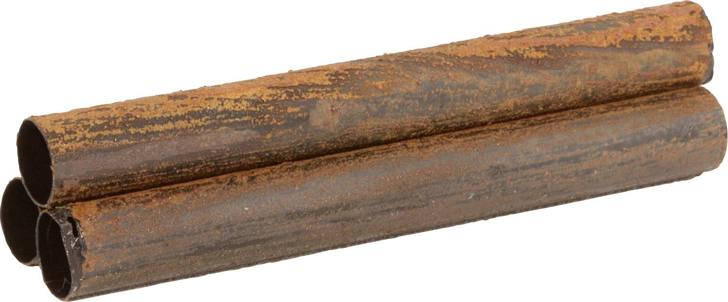 Three rusty metal pipes lying side by side.