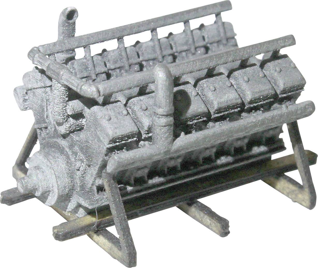 A grey model of an engine on a stand, with visible cylinders and pipes, presents a technical mechanism.