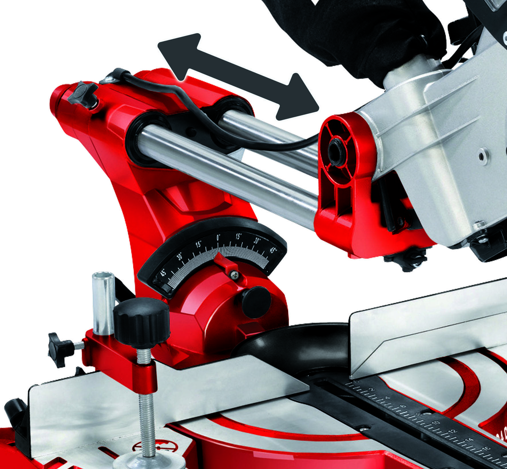 Saw blade of a red and silver mitre saw, tilting to the left or right. Angle indicator and adjustment lever are visible.