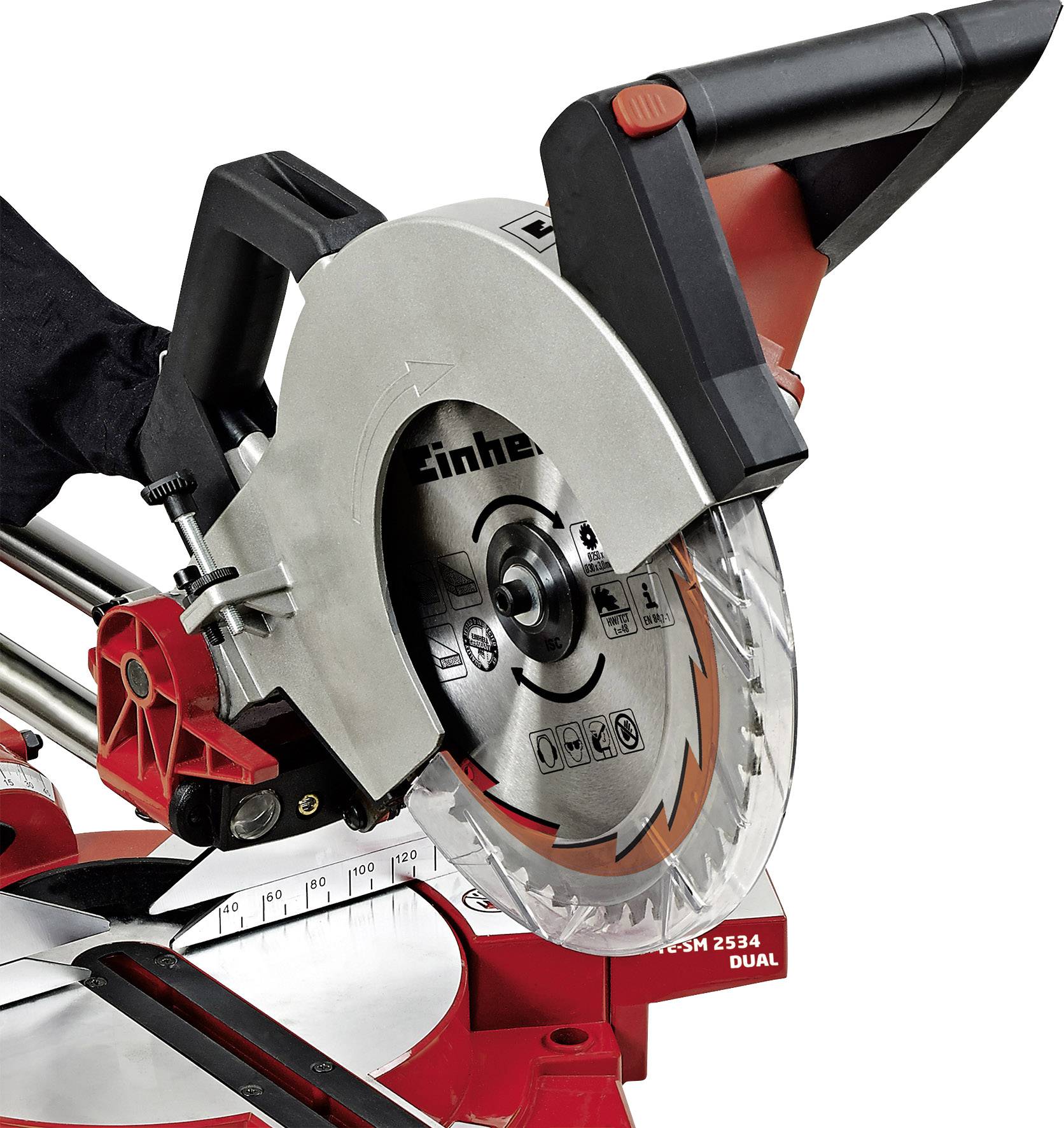 Mitre saw with a silver saw blade and red housing, mounted on a table.