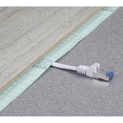 An Ethernet cable protrudes from beneath a wooden board on a grey floor. It appears as though the board has just been laid.