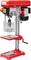 Red pillar drill with lever, switch, and stand. Suitable for precise drilling work.