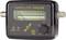 A black satellite finder with display and rotary dial shows signal strength from 0 to 10. Connections on the left and right.