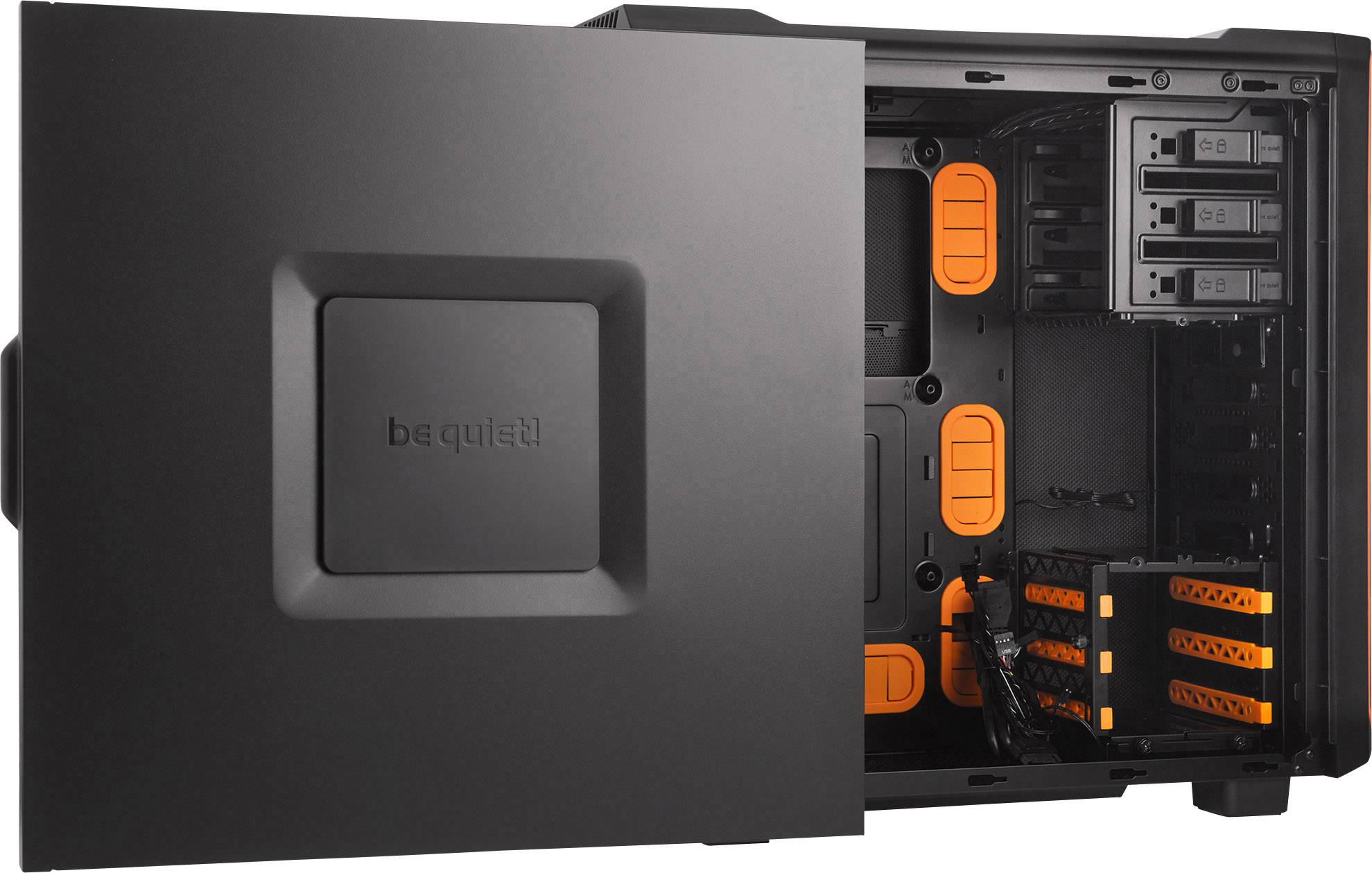 An open PC case with black and orange elements, four hard drive bays and multiple ventilation slots.