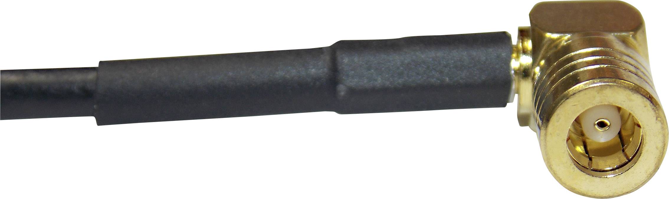 A golden angled plug connected to a black cable, close-up of the plug.