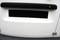 White surface with a black, rectangular slit and a black bar above it.