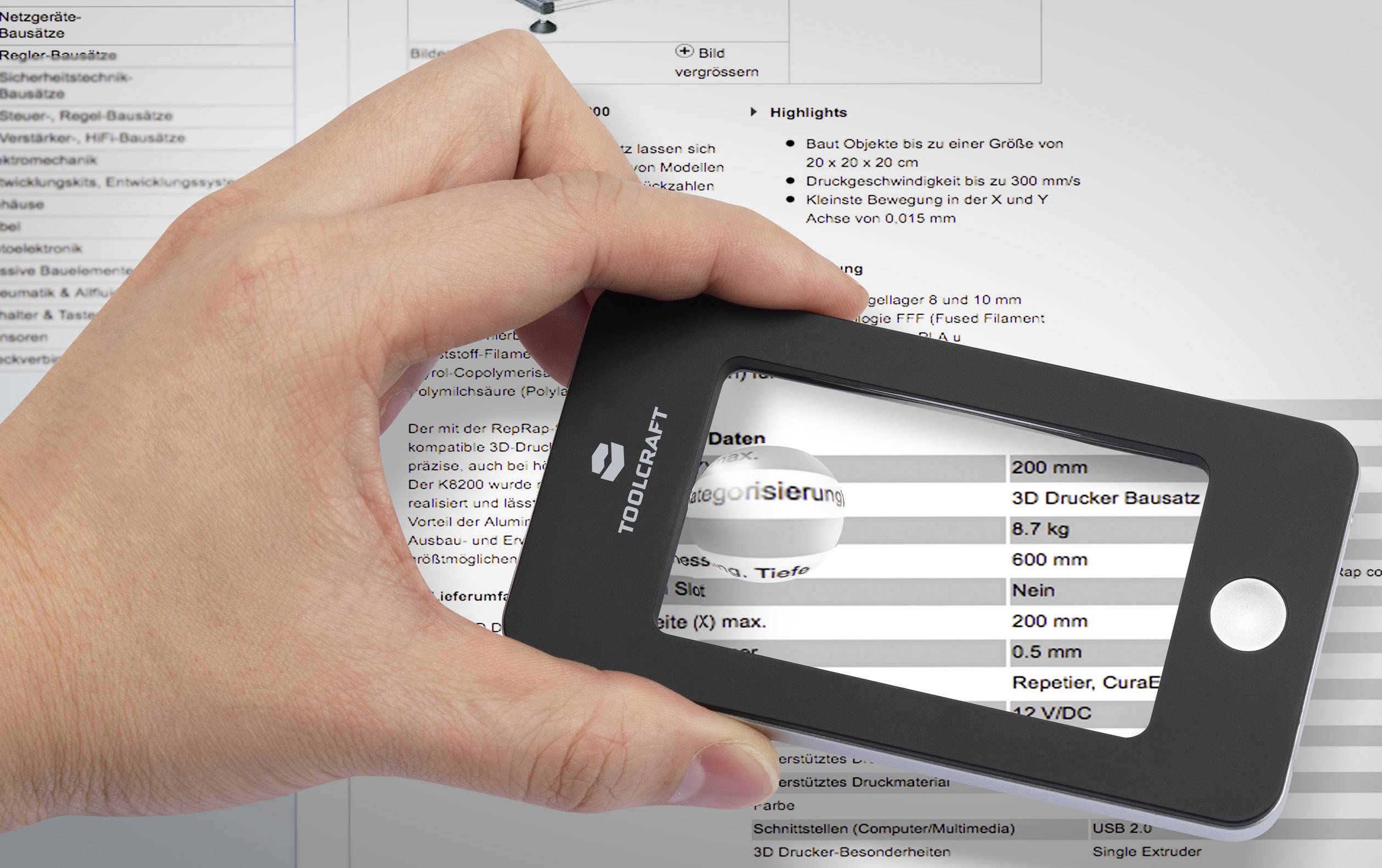 A hand is holding a black, rectangular magnifying glass that enlarges text on a document. The text is partially blurred.