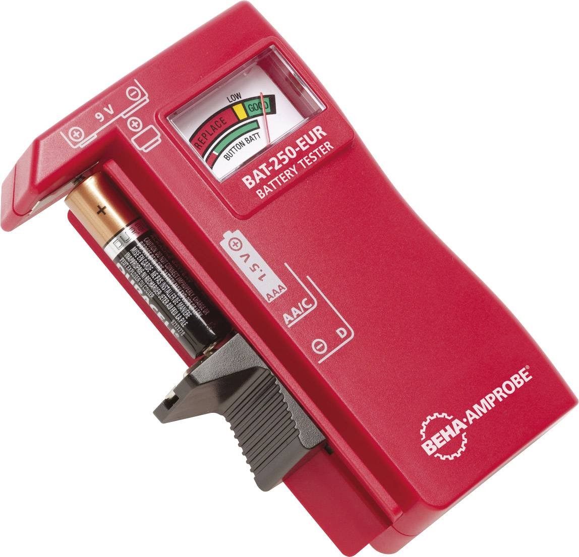 Red battery tester with analogue display showing battery level. Button cell and standard battery are positioned for testing.