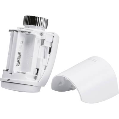 Depict a white, open radiator thermostat; showing the battery compartment and the removed cover.