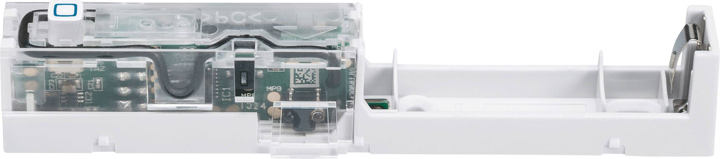 Electronic circuit in a white casing, showing printed circuit boards and electronic components. Primarily green and white.