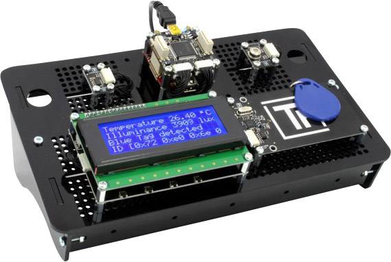 Electronic device with a screen displaying temperature, light levels, and ID number. Surrounded by various sensors and ports.<br><br>(Note: This translation uses British English vocabulary and maintains the original technical description)