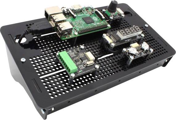 Microcontroller board with various modules, including a display, mounted on a perforated metal plate.