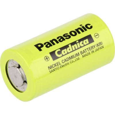 Yellow, cylindrical nickel-cadmium battery in close-up, with the inscription 'Panasonic Cadnica', produced in Japan.