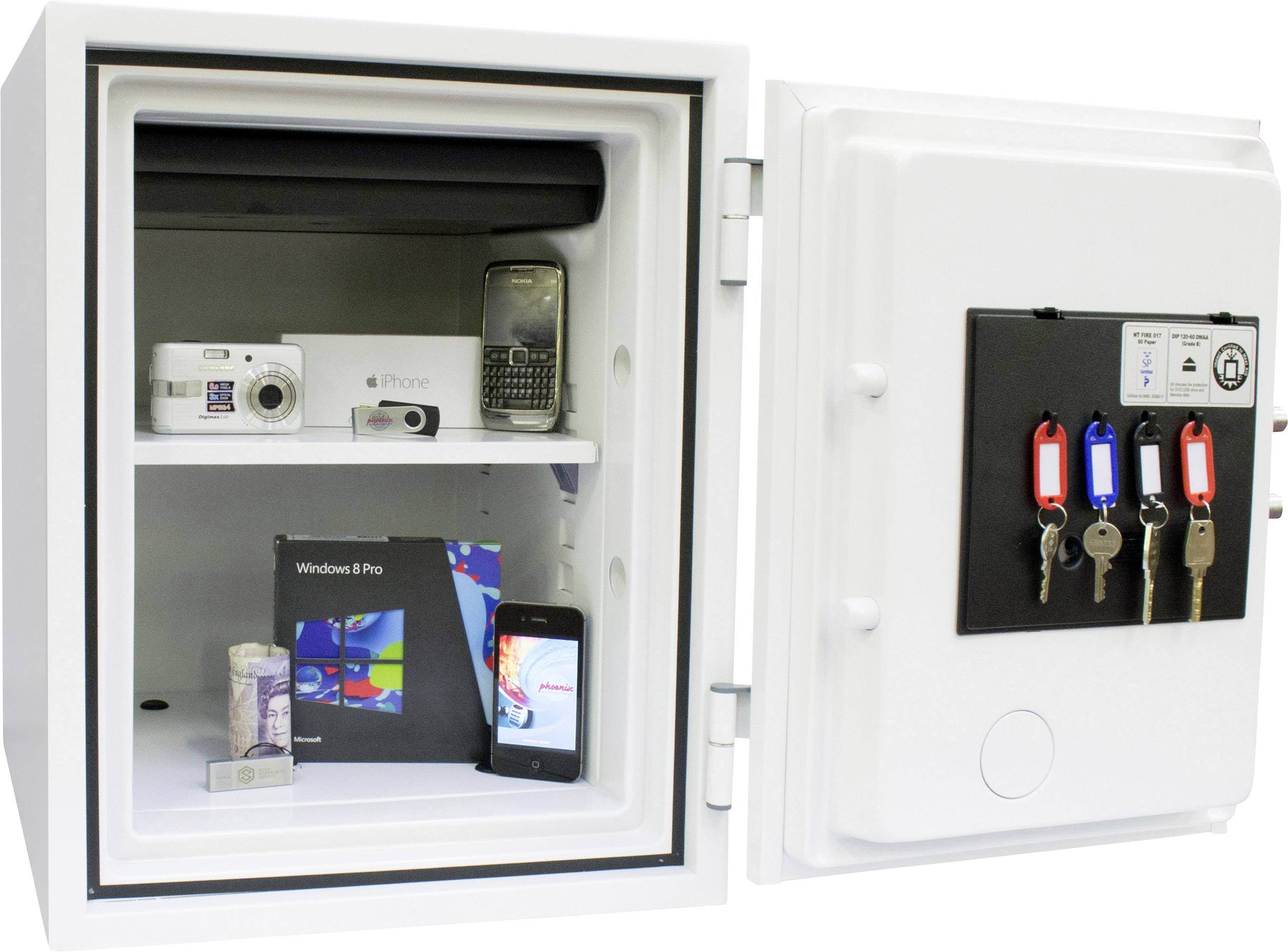 An open safe reveals two shelves with electronic items: a camera, a mobile phone packaging, and a smartphone. Three keys are visible on the door.
