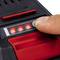 A finger presses a button on a device to switch on four red LED lights.