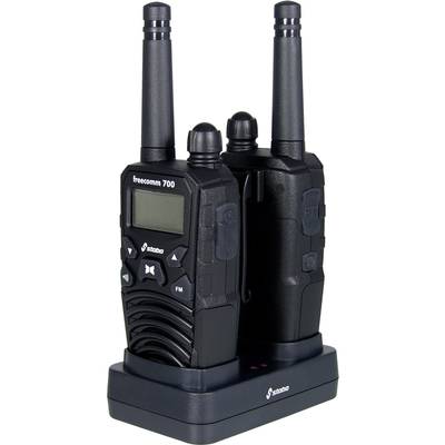 'Two black two-way radios in a charging station. Both have aerials, a display and buttons. The charging station shows red charging LEDs.'
