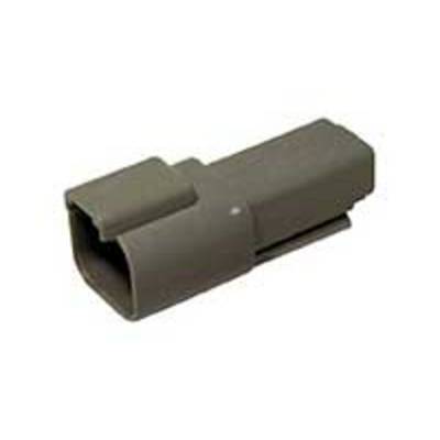 A grey plastic connector part in a rectangular shape, possibly a housing or cover for an electrical connection.