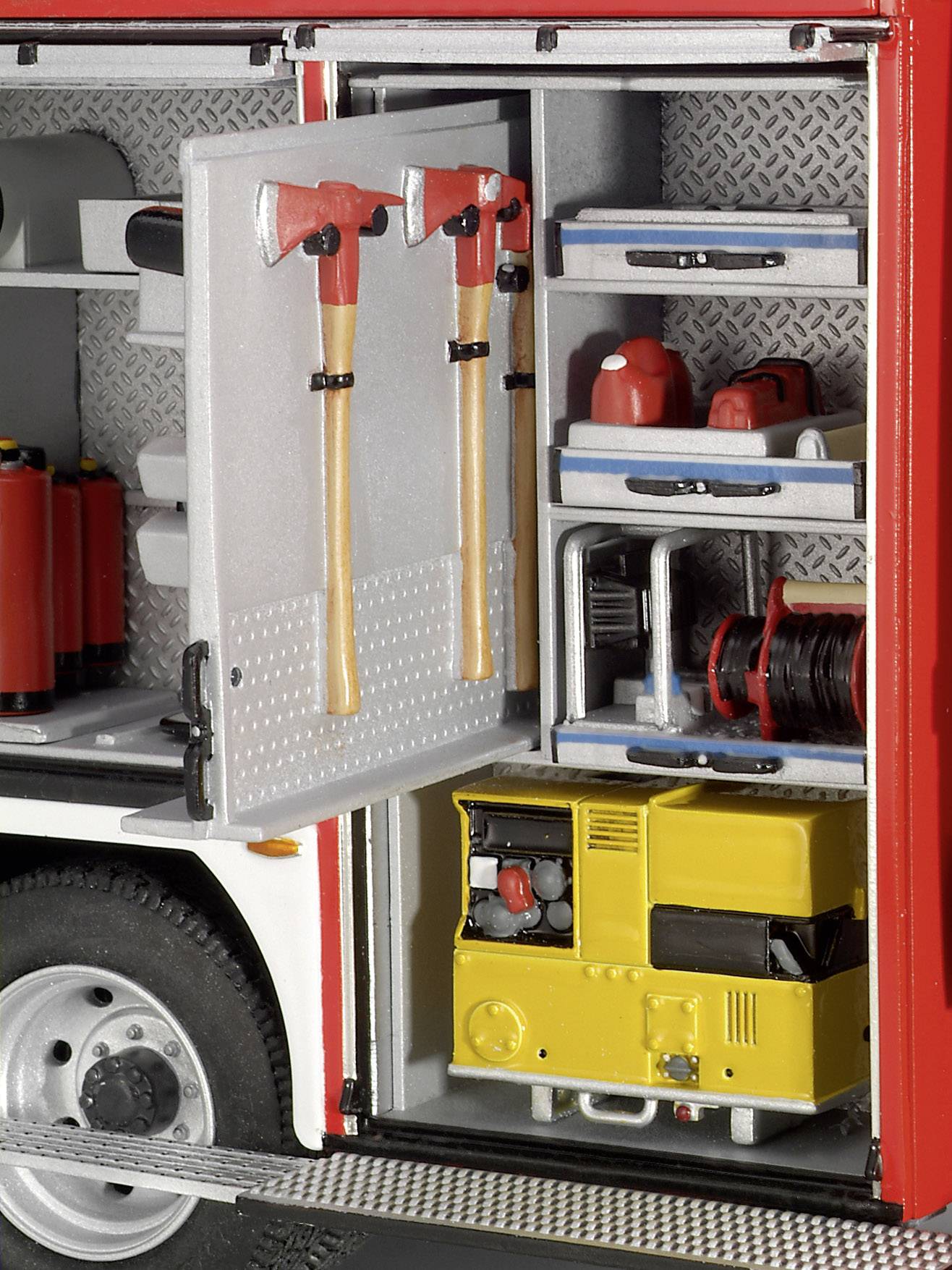 An open fire engine compartment shows two red axes, fire extinguishers, hoses, and a yellow power supply unit.
